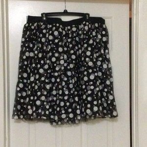 Black and white polka dot tulle skirt. Skirt is lined